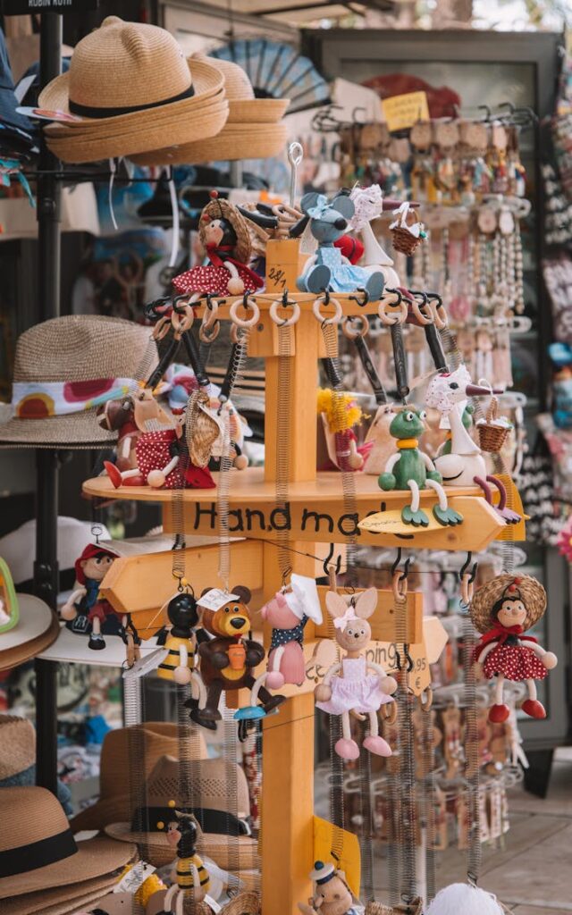 Vibrant handmade toys and souvenirs showcase in a sunny Málaga shop.